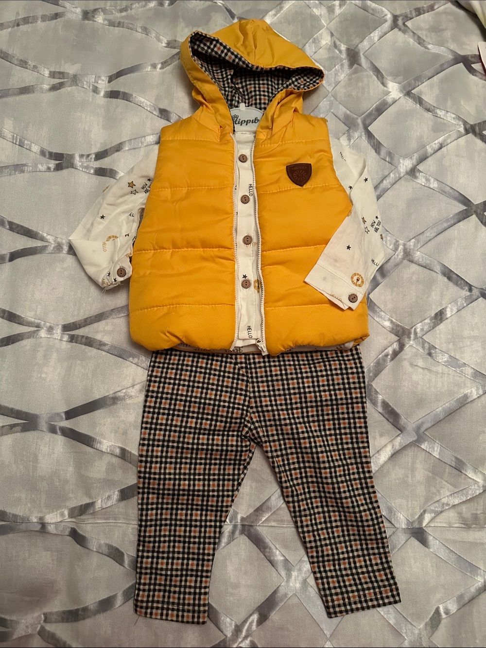 3 piece outfit. Yellow Quilted Hooded Puffer Vest, Plaid Pants, Cream Shirt